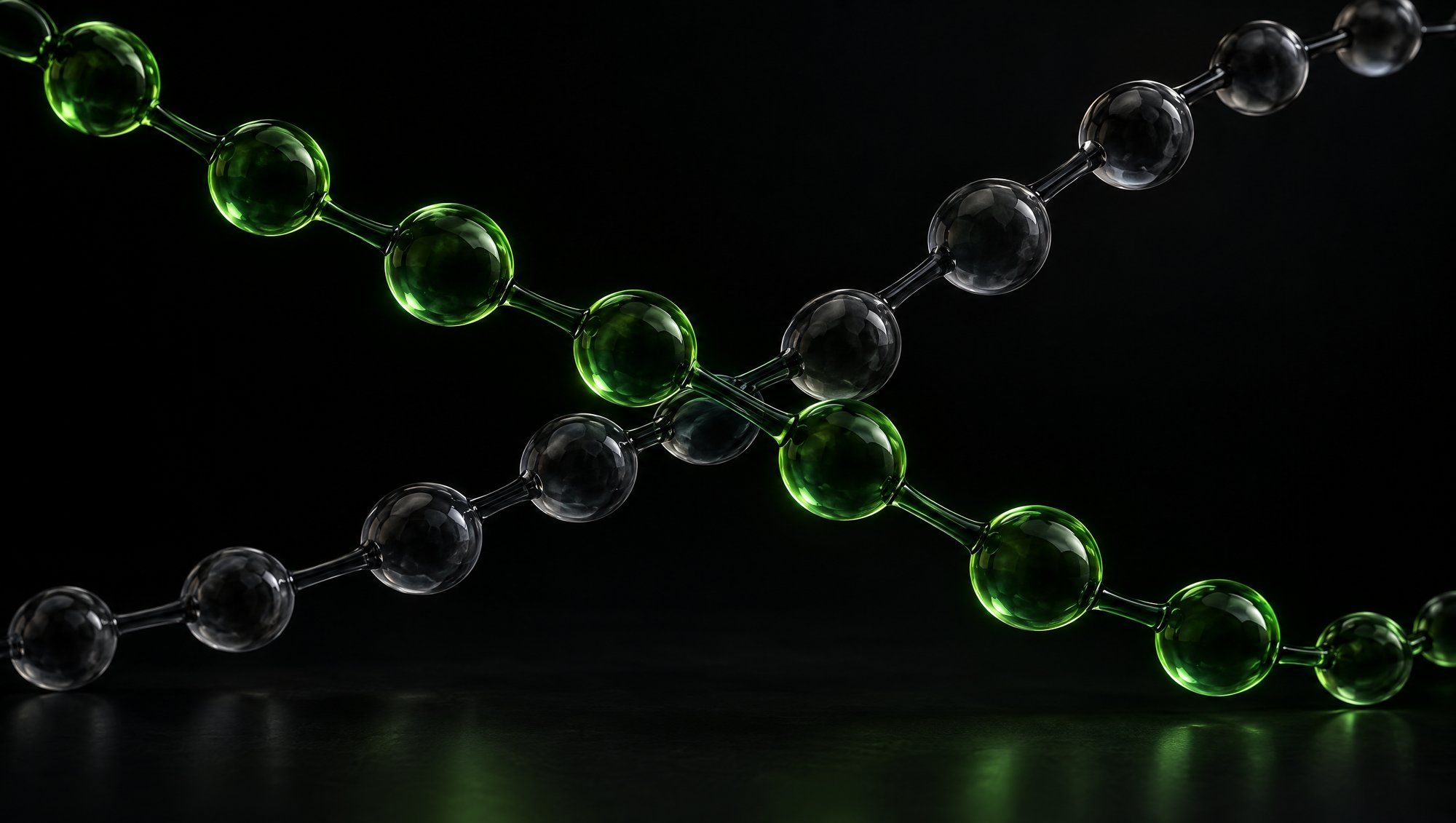 Two chains of glass beads joined by thin glass rods crossing in darkness, one glowing green and one dim grey.